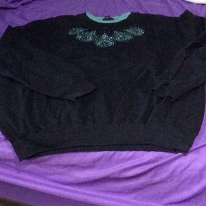 Black trilogy sweatshirt with turquoise trim.   W202